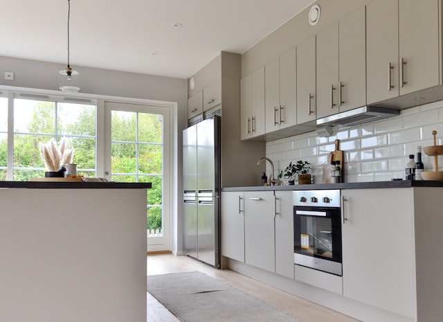 Modern white kitchen on sunny day